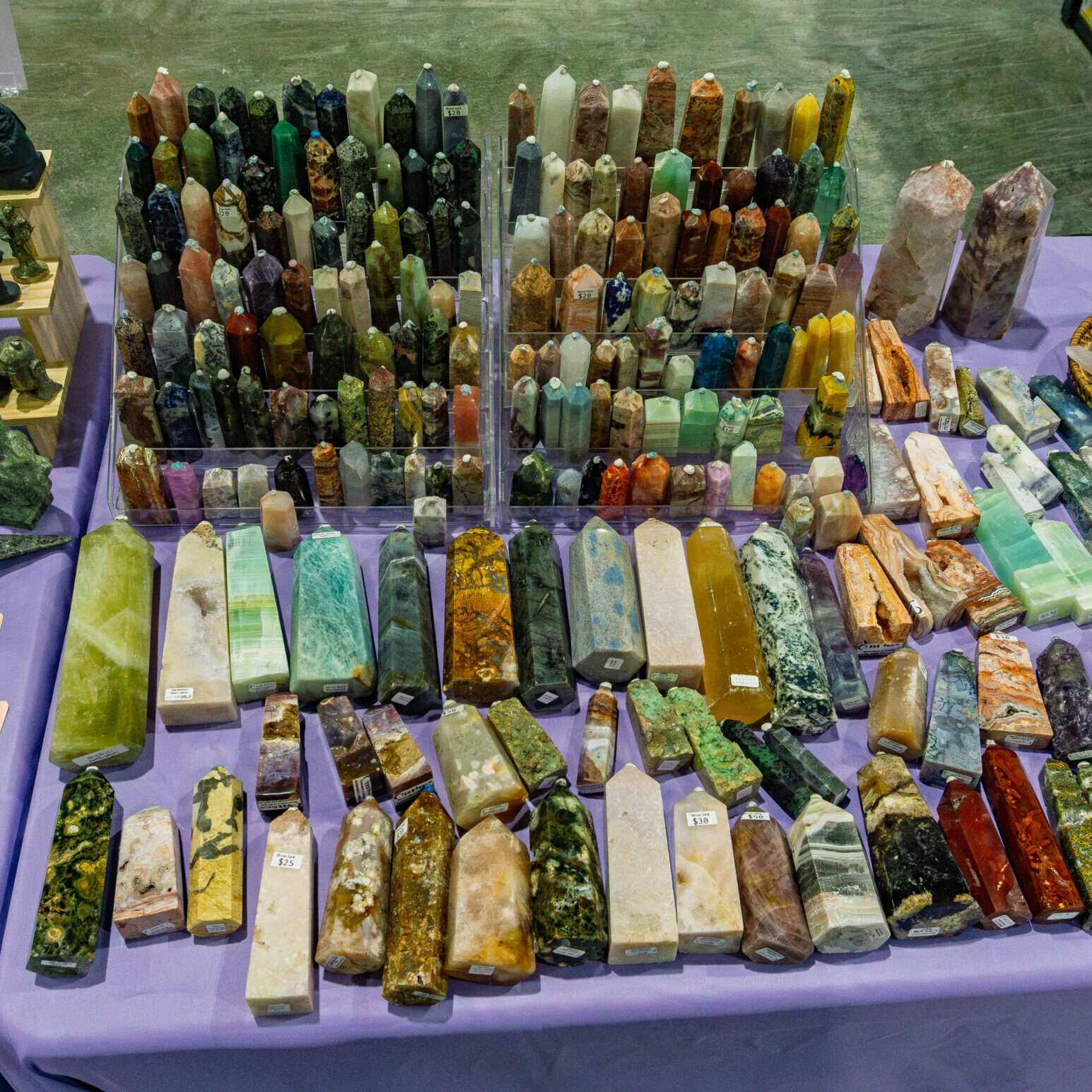 Rows of crystal towers, tumbled stones and polished gemstones at a Kitchener Rock and Gem Expo vendor display