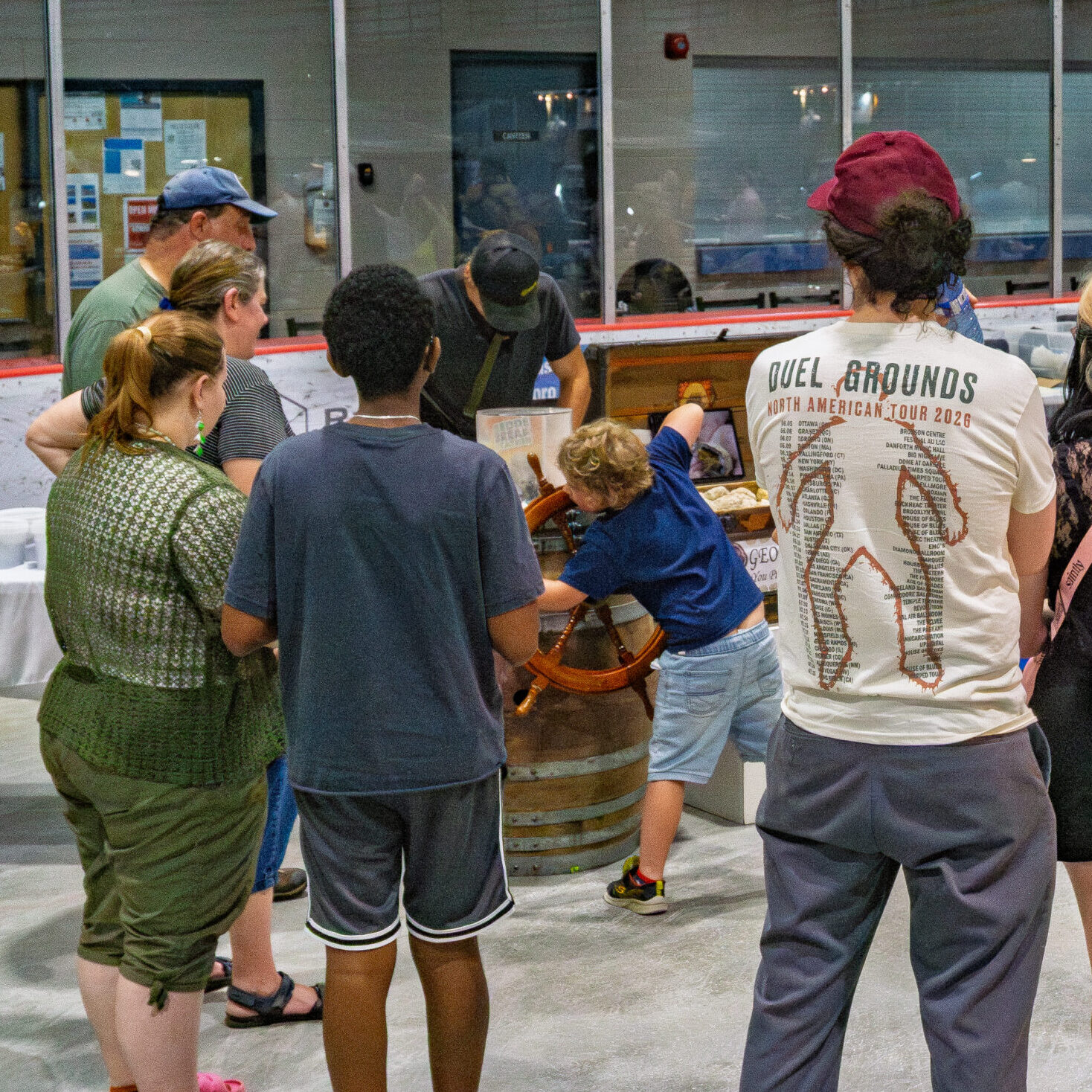 Family cracking open a geode at the Rock & Gem Expo Geode Cracking Station